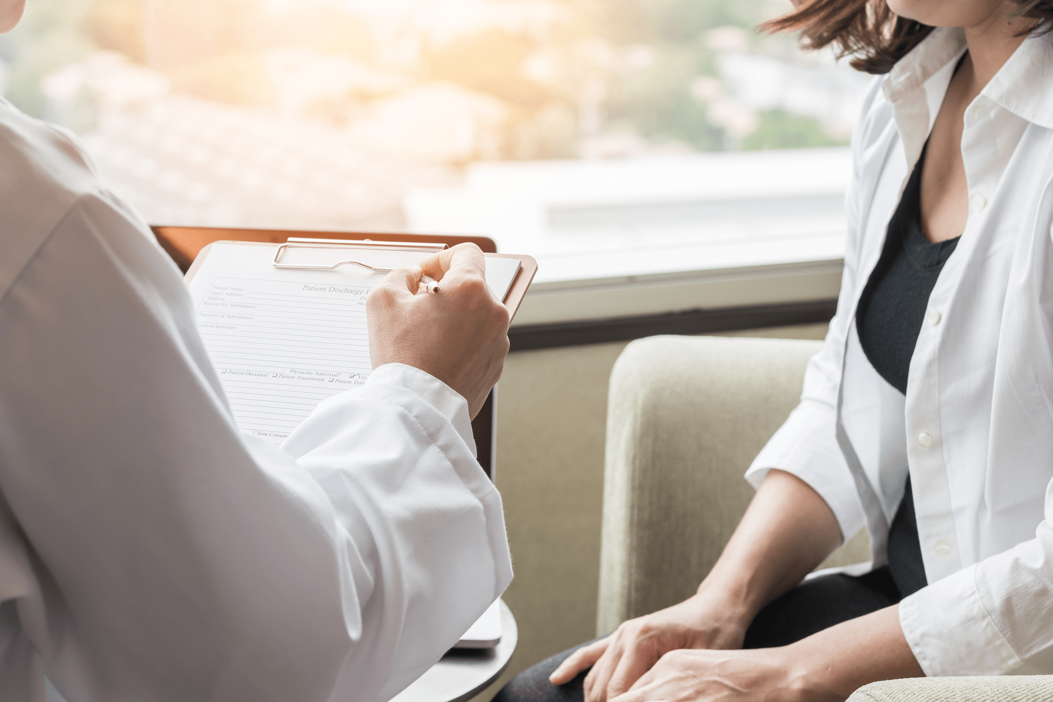 Consultation notes being taken at a one-stop breast assessment